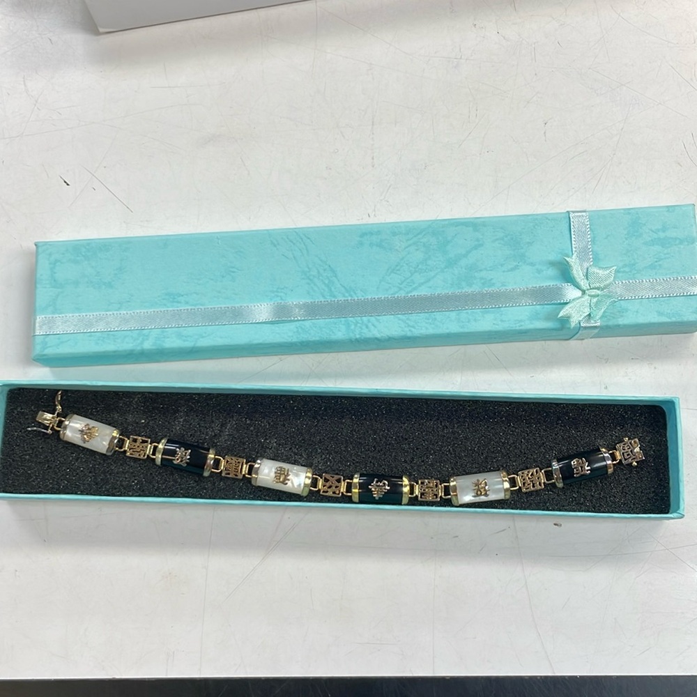 Onyx and mother of pearl Asian style bracelet gold toned